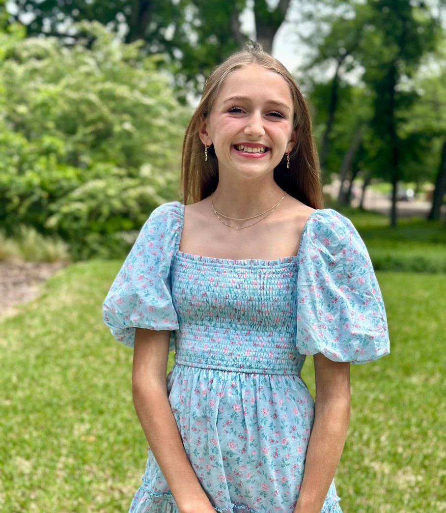 Julianna Breed, founder of JJB Toffee Co., smiling outdoors
